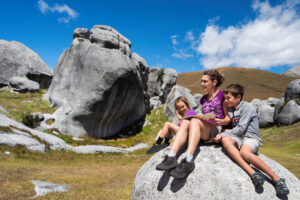Castle Hill Day Tour From Lyttelton Shore Excursion Girls On Rock
