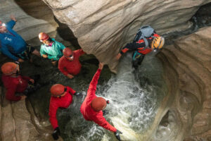Cave Stream Castle Hill Day Tour People In Water Crevice