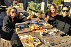 Discovery Full Day Marlborough Wine Tour Group Of Women Enjoy Lunch And Tasting