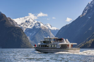 Milford Track Guided Walk Boat Cruise Boat Underway In Lake