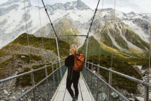 Mt Cook Scenic Tour Hooker Valley Track Woman On Bridge