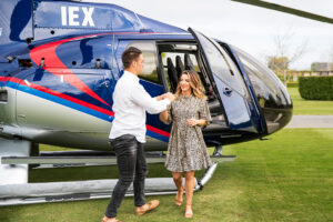 Akaroa Heli Lunch Caldera Vineyard Couple Steps Off Helicopter