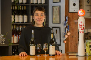 Bay Of Islands Wine Spirit Craft Beer Tour Woman Showcases Wine
