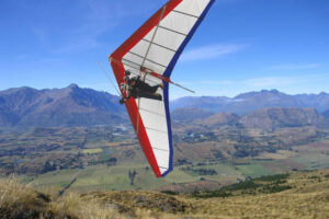 Gliding And Hang Gliding Combo Pair Flying On Hang Glider