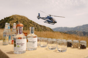 Heli Gin Meet Mt Fyffe Distillery Helicopter Over Table Of Gin