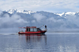 Private Cruise Boat With Mountain In Background