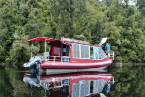 Private Fishing Charter Franz Josef Boat In River