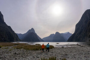 Private Milford Sound Experience With Shared Boat Cruise Pair Walk On Rocky Shores Of Lake