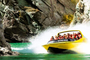 Queenstown Jet Boat Wine And Food Tour Guest Enjoy Jetboat In River