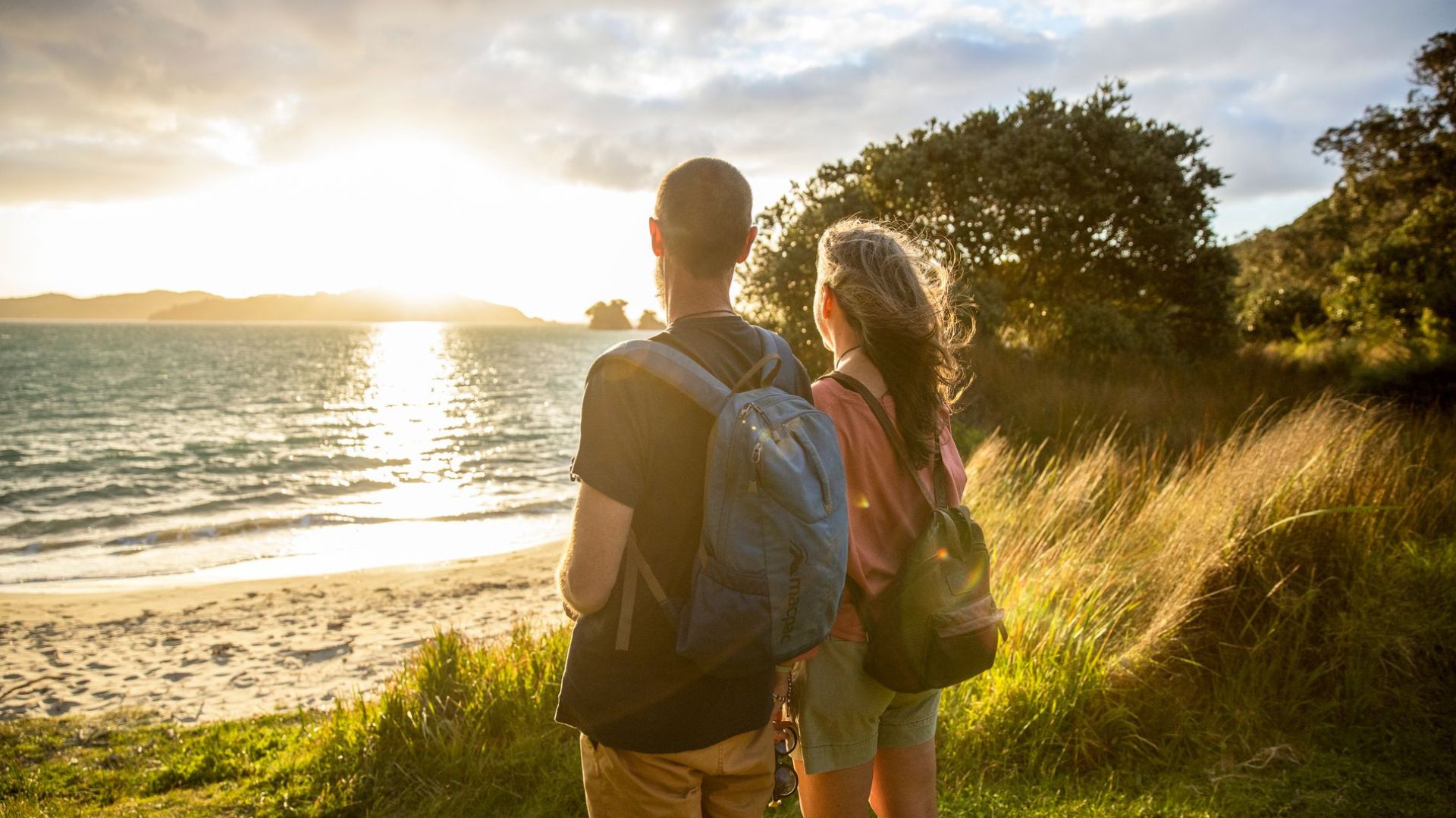 Couple overlooking the ocean on Urupukapuka Island in Northland